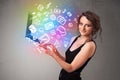 Young lady holding notebook with colorful hand drawn multimedia Royalty Free Stock Photo