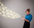 Young lady holding a phone with message icons