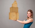 Young lady holding a set of brown cardboard boxes Royalty Free Stock Photo