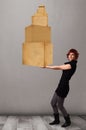 Young lady holding a set of brown cardboard boxes Royalty Free Stock Photo