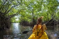 Young lady paddling hard the sea kayak with lots