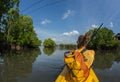 Young lady paddling hard the sea kayak with lots Royalty Free Stock Photo