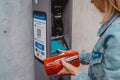 young lady paying for her parking ticket using credit card at pay station terminal Royalty Free Stock Photo