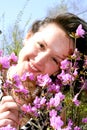 Young lady in pink rhododendrons