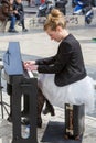 Young lady playing electric piano at Aristotelous square