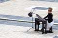 Young lady playing electric piano at Aristotelous square