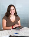 Young lady preparing USA tax form 1040 for 2012 Royalty Free Stock Photo