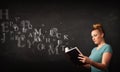 Young lady reading a book with alphabet letters