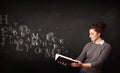 Young lady reading a book with alphabet letters