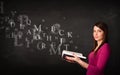 Young lady reading a book with alphabet letters