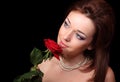 Young lady with red rose Royalty Free Stock Photo