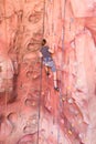 Young lady rock climbing