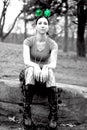 Young lady sitting on a rock, Irish theme