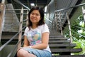 Young lady sitting at stair