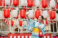 Young lady standing in front of the lantern wall