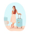 Young lady standing with luggage, holding passport and ticket Royalty Free Stock Photo