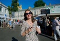 Young lady in sunglasses drinking wine Royalty Free Stock Photo