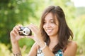 Young lady taking photos outdoors Royalty Free Stock Photo