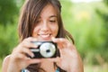Young lady taking photos outdoors Royalty Free Stock Photo
