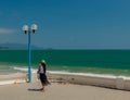 Young Lady Tourist Taking Vacation Photographs