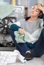 young lady trying to repair washing machine Royalty Free Stock Photo