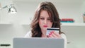 A Young Lady Using a Laptop Indoors Royalty Free Stock Photo