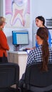 Young lady visiting stomatological clinic for teeth checking Royalty Free Stock Photo