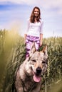 Young lady on a walk with a dog