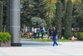 Young lady walks with phone