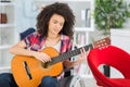 young lady in wheelchair playing guitar Royalty Free Stock Photo