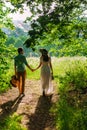 Young lady in a white summer dress with a flower Royalty Free Stock Photo