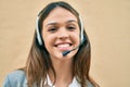 Young latin call center aget girl smiling happy using headset at the city Royalty Free Stock Photo