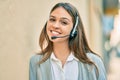 Young latin call center aget girl smiling happy using headset at the city Royalty Free Stock Photo