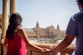 Young latin couple looking at Plaza de EspaÃÂ±a Sevilla in Spain