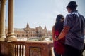 Young latin couple looking at Plaza de EspaÃÂ±a Sevilla in Spain