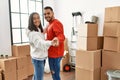 Young latin couple smiling happy dancing at new home Royalty Free Stock Photo