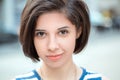 young latin hispanic girl woman with short dark black hair bob, outside looking in camera Royalty Free Stock Photo