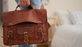 Young latin man business worker holding briefcase at hotel room Royalty Free Stock Photo