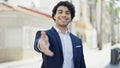 Young latin man business worker smiling confident shake hand at street Royalty Free Stock Photo