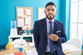 Young latin man business worker smiling confident standing at office Royalty Free Stock Photo