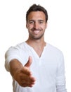 Young latin man giving hand Royalty Free Stock Photo