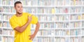 Young latin man latino showing pointing library books student people banner copyspace copy space Royalty Free Stock Photo