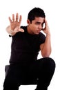 Young latin man, pensive, with his hand stop Royalty Free Stock Photo