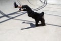 Latin man performing street dance inside skating pit