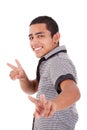 Young latin man with thumbs raised -victory