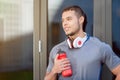 Young latin man water bottle looking thinking day dreaming runner copyspace copy space running sports training fitness Royalty Free Stock Photo