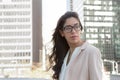 Young latin professional woman with glasses in the city Royalty Free Stock Photo