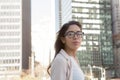 Young latin professional woman with glasses in the city Royalty Free Stock Photo