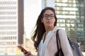 Young latin professional woman with glasses in the city Royalty Free Stock Photo