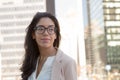 Young latin professional woman with glasses in the city Royalty Free Stock Photo